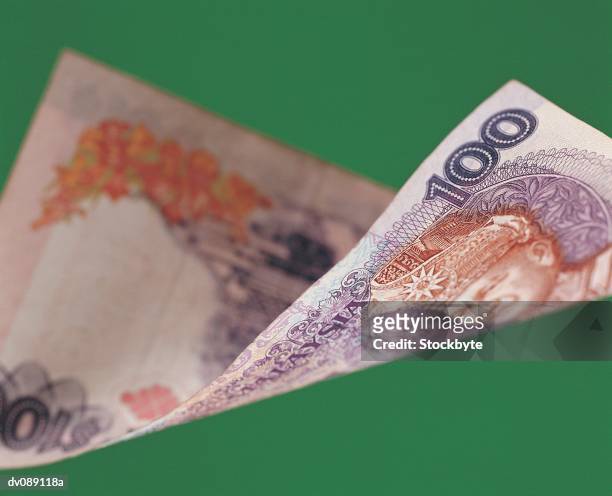 malaysian one hundred ringgit note - malaysian ringgit stock pictures, royalty-free photos & images