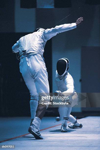 fencer avoiding thrust of opponent - fencing sport stock pictures, royalty-free photos & images