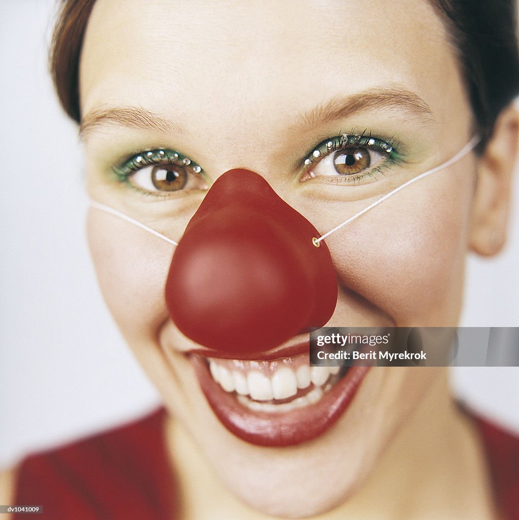 Portrait of a Young Woman Wearing a Clown Nose