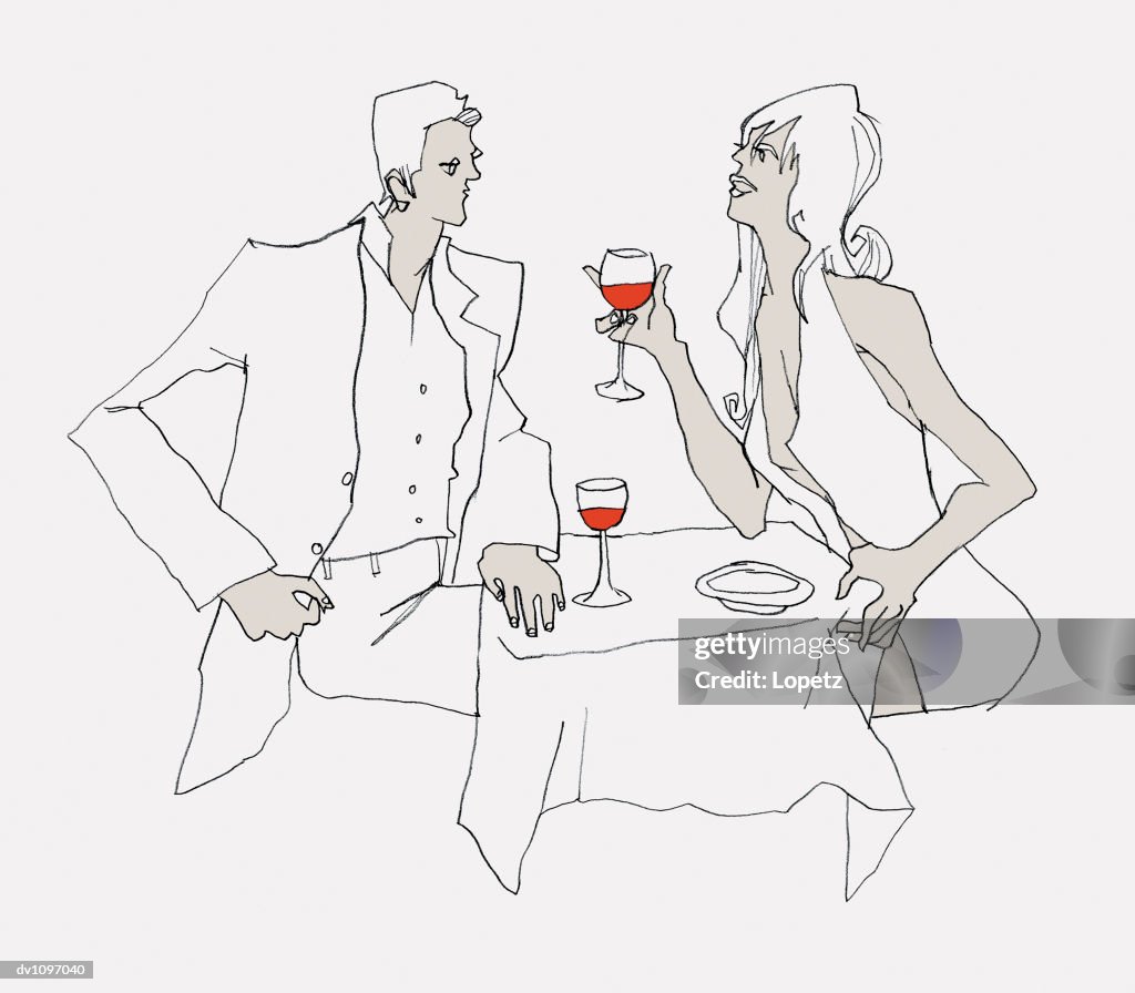 Young Man and a Woman Sitting at a Restaurant Table and Drinking Red Wine