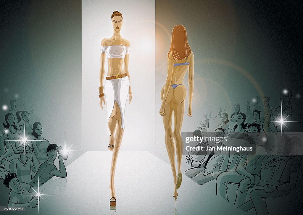 Two Female Models Walking on the Catwalk