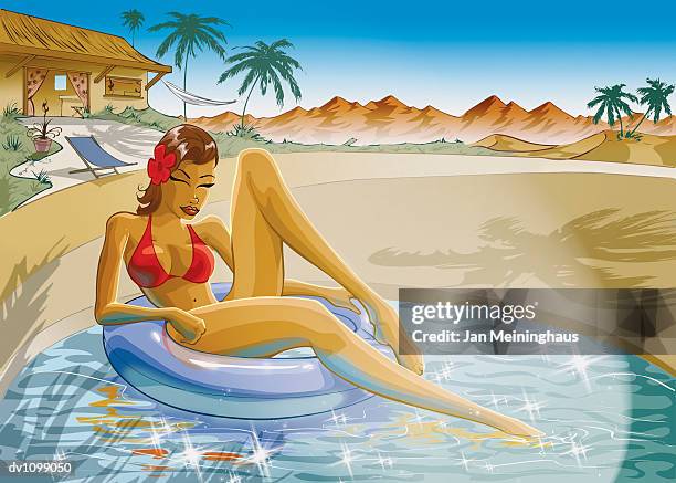 young woman relaxing on a rubber ring in her swimming pool in front of her holiday villa - rubber ring stock-grafiken, -clipart, -cartoons und -symbole