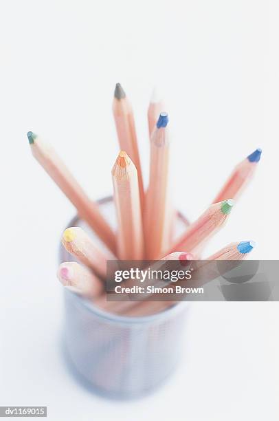 elevated view of a group of colouring pencils in a cup - colouring fotografías e imágenes de stock