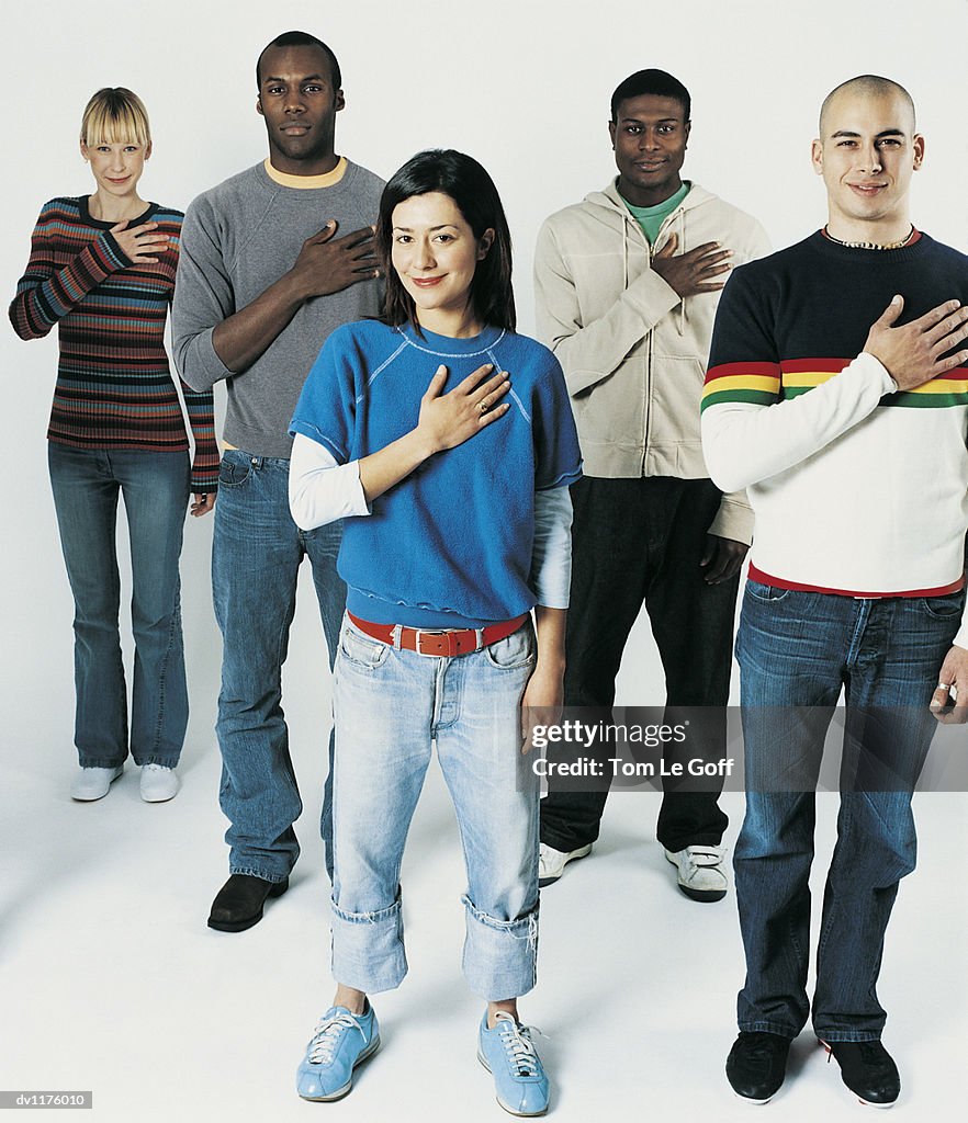 Portrait of Five Young Adults Swearing the Pledge of Allegiance