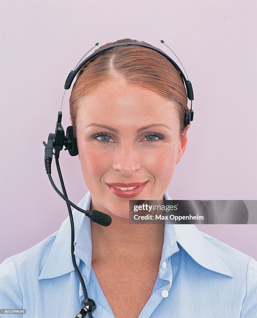 Portrait of a Smiling Businesswoman Wearing a Headset