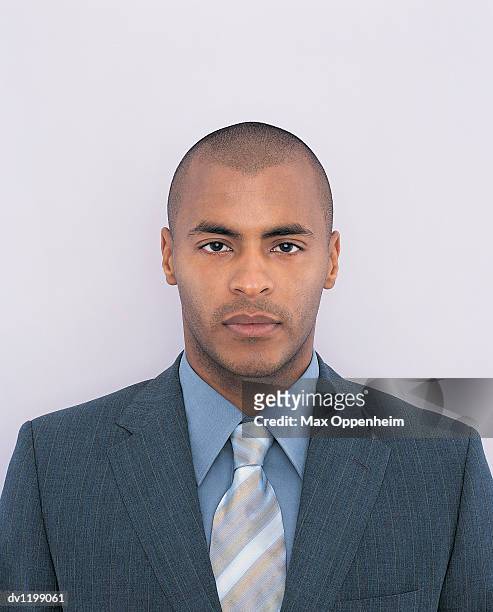 portrait of a young businessman - striped suit stock pictures, royalty-free photos & images