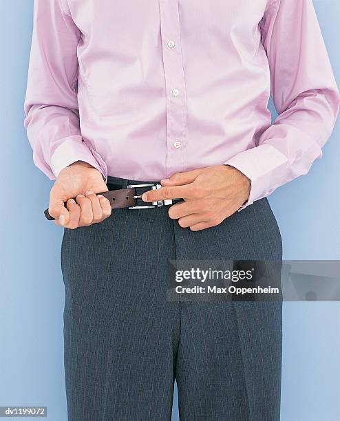 Adjusting Adjusting Belt Photos and Premium High Res Pictures - Getty Images