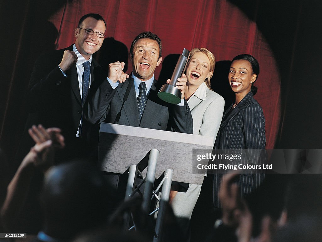Happy Business People Receiving a Prize at an Award Ceremony