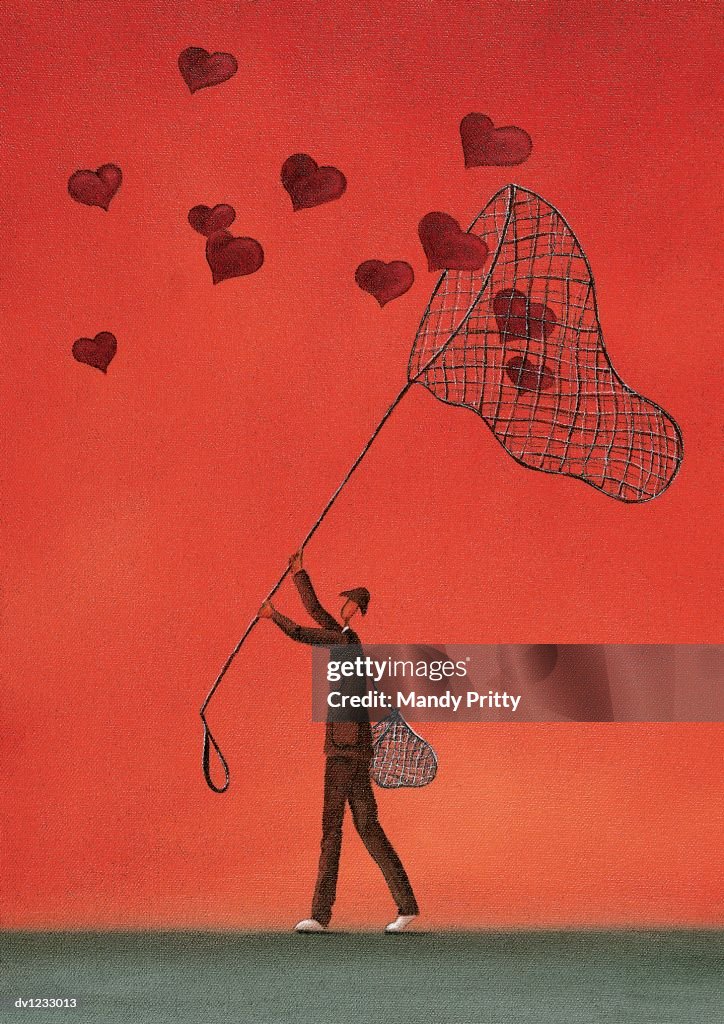 Man Catching Heart Shapes With a Net