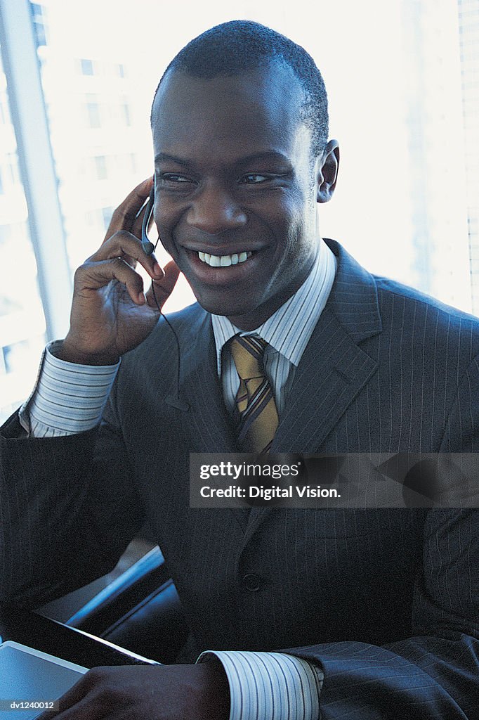 Businessman Talking on a Hands Free Device