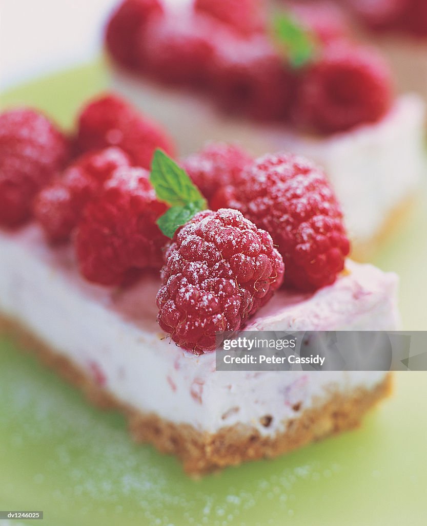 Close up of Cheesecake Desserts With Raspberries