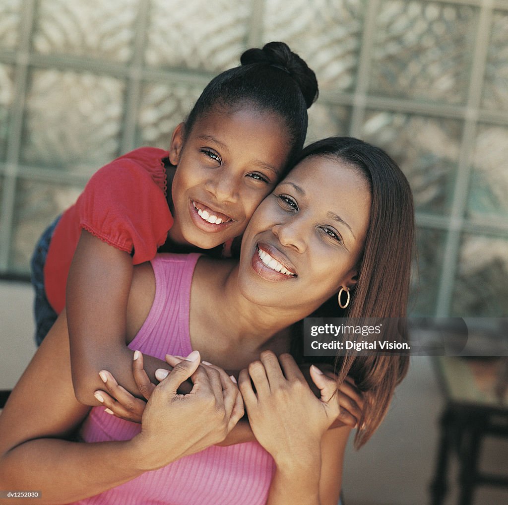 Portrait of Daughter With her Arms Round her Mother