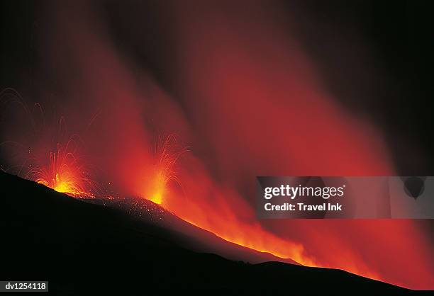 lava flowing from a volcanic eruption on mt etna, sicily, italy - mt etna fotografías e imágenes de stock