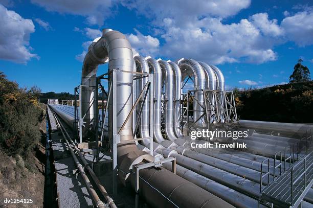 pipelines from a geothermal power station, wairakei, north island, new zealand - wairakei stock pictures, royalty-free photos & images