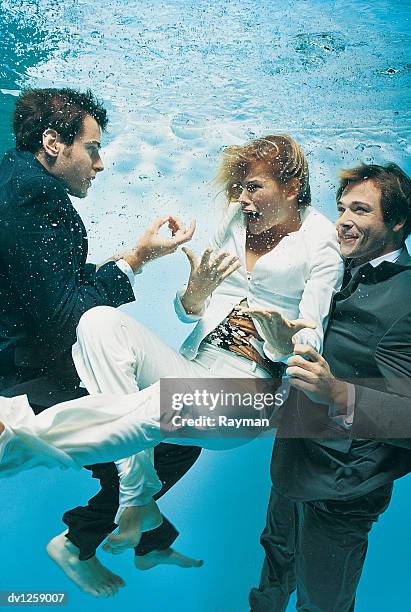business people underwater attempting to communicate - enclosed pool fotografías e imágenes de stock