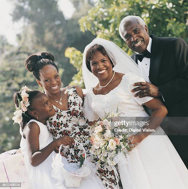 portrait of senior newlyweds with family - mother and daughter smoking stock-fotos und bilder