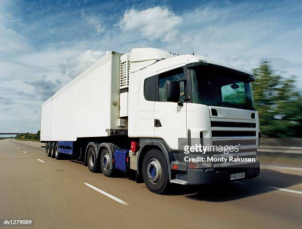 lorry moving along a motorway, immingham, humberside, uk - humberside stock-fotos und bilder