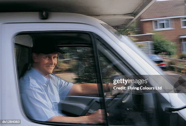 portrait of a man wearing a cap and driving a delivery van in the suburbs - reliance industries ltd stock pictures, royalty-free photos & images