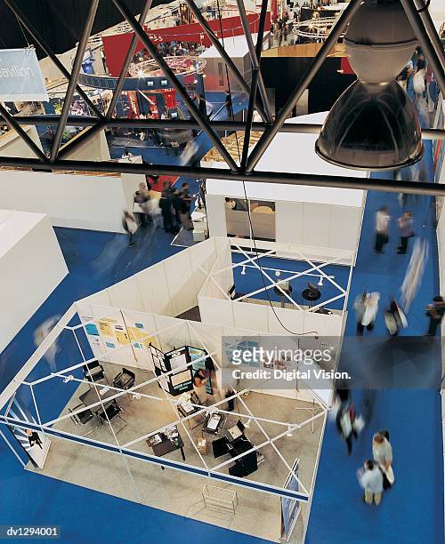 elevated view of stalls at a business exhibition - tradeshow stock pictures, royalty-free photos & images