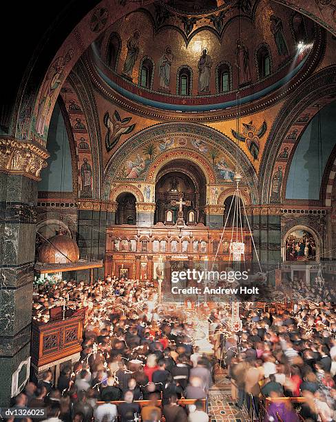 elevated view of the altar and nave during a mass in a cathedral - mass stock-fotos und bilder