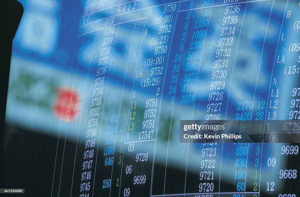 Chinese Script Reflected Over Stock Market Data