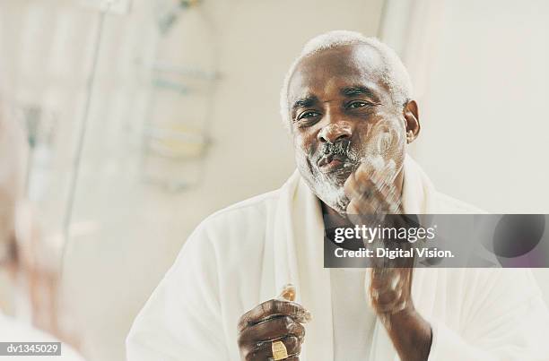 mature man applying shaving foam - man shaving foam stock pictures, royalty-free photos & images