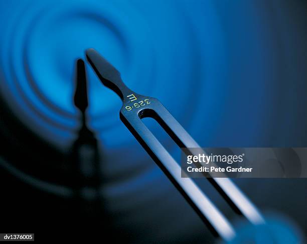 close up of a metal tuning fork - tuning stock pictures, royalty-free photos & images