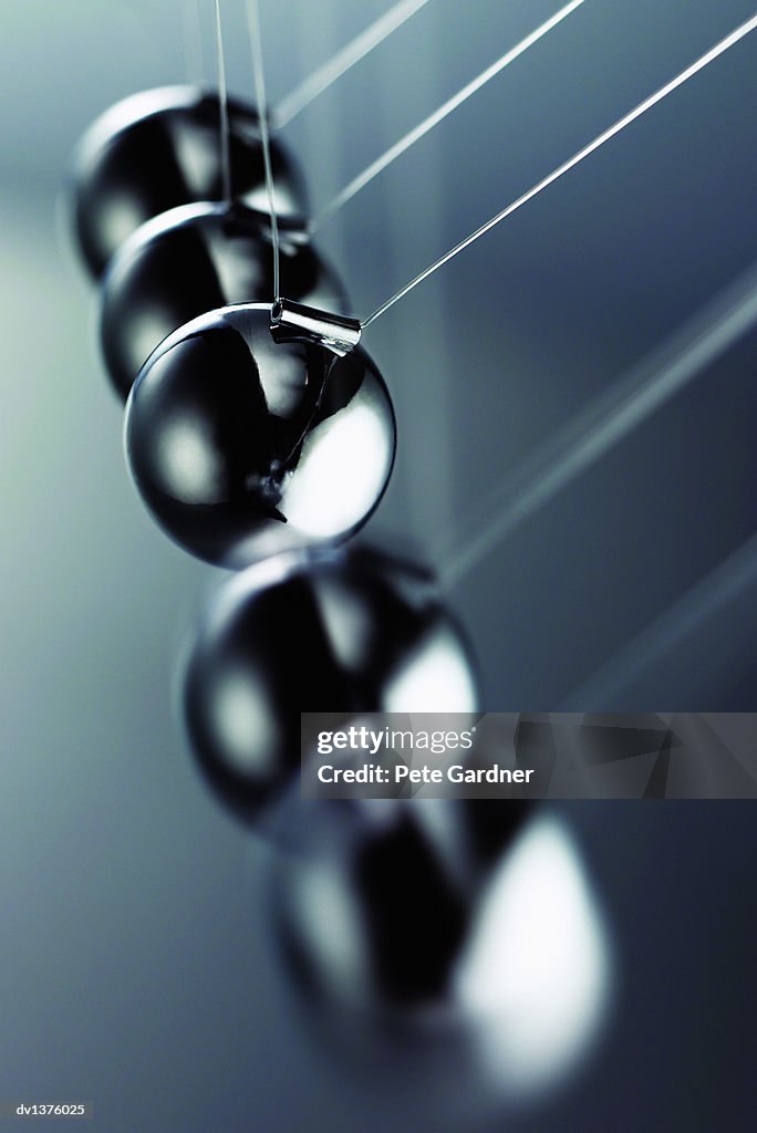Close Up of the Metallic Balls on a Newton's Cradle