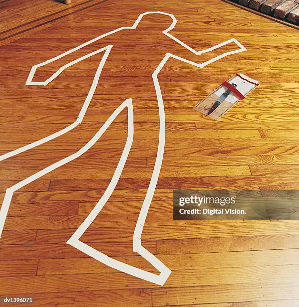 crime scene and a knife in an evidence bag - crime scene outline stock pictures, royalty-free photos & images