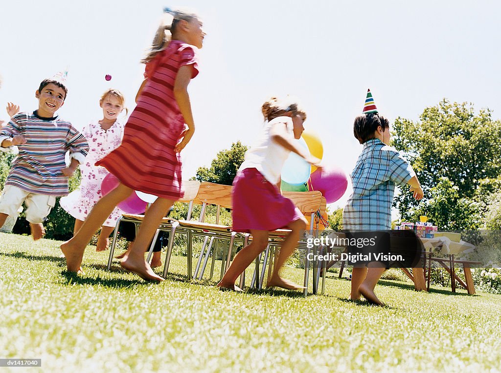 Five Children Playing a Game at a Birthday party