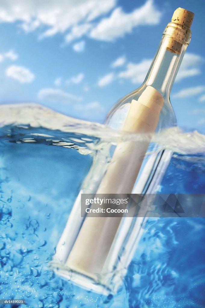 Message in a Bottle Floating on Water Surface Level