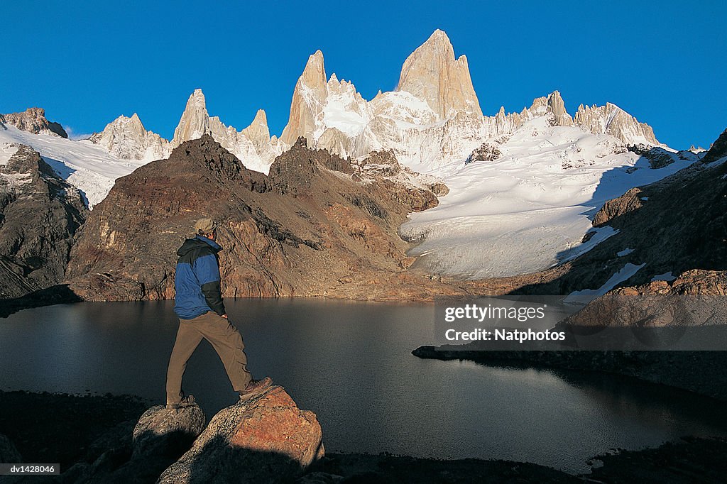 Hiker Looking at the View of Lagos De Los Tres With Mt Fitzroy in the Background, Glacier National Park, Patagonia, Argentina