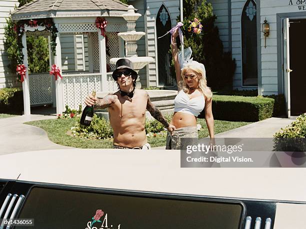 newlywed couple walking from the church to their limousine - las vegas wedding ストックフォトと画像