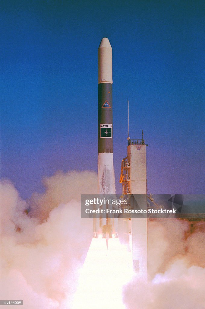 NATO satellite lifting off from launch pad