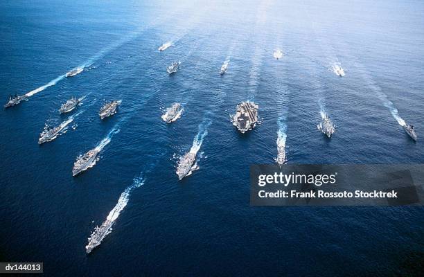 group of ships in persian gulf, including uss john f kennedy (cv-67) aircraft carrier - aerial warship stock pictures, royalty-free photos & images