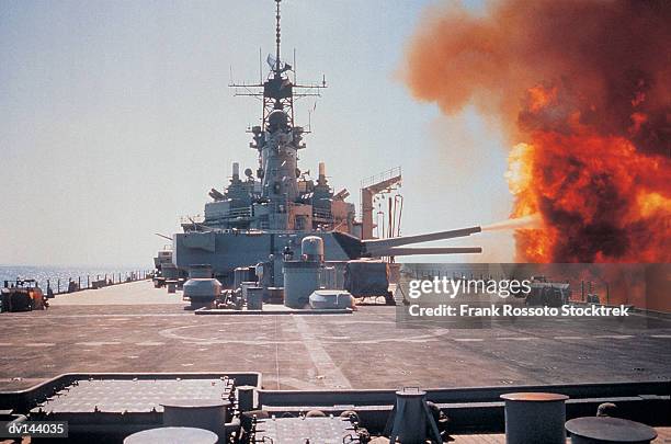 guns firing on battleship uss wisconsin - uss wisconsin stock pictures, royalty-free photos & images