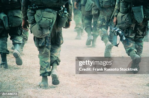 Soldiers marching in desert Soldiers marching in desert