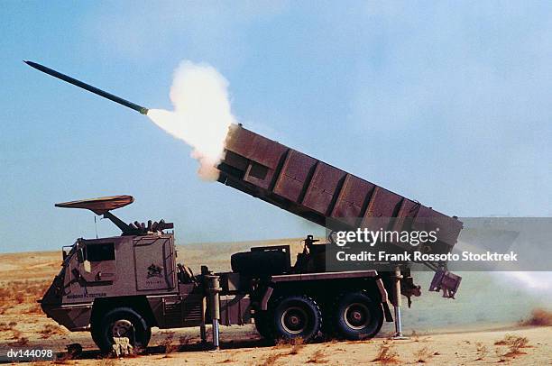 astros 11 ss-30 rocket being launched from truck in desert - lanzacohetes fotografías e imágenes de stock
