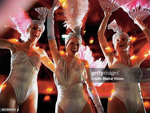 line of dancers performing on stage - cabaret imagens e fotografias de stock