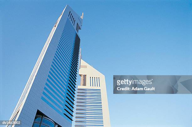 emirates towers, dubai, united arab emirates - emirates towers stock pictures, royalty-free photos & images