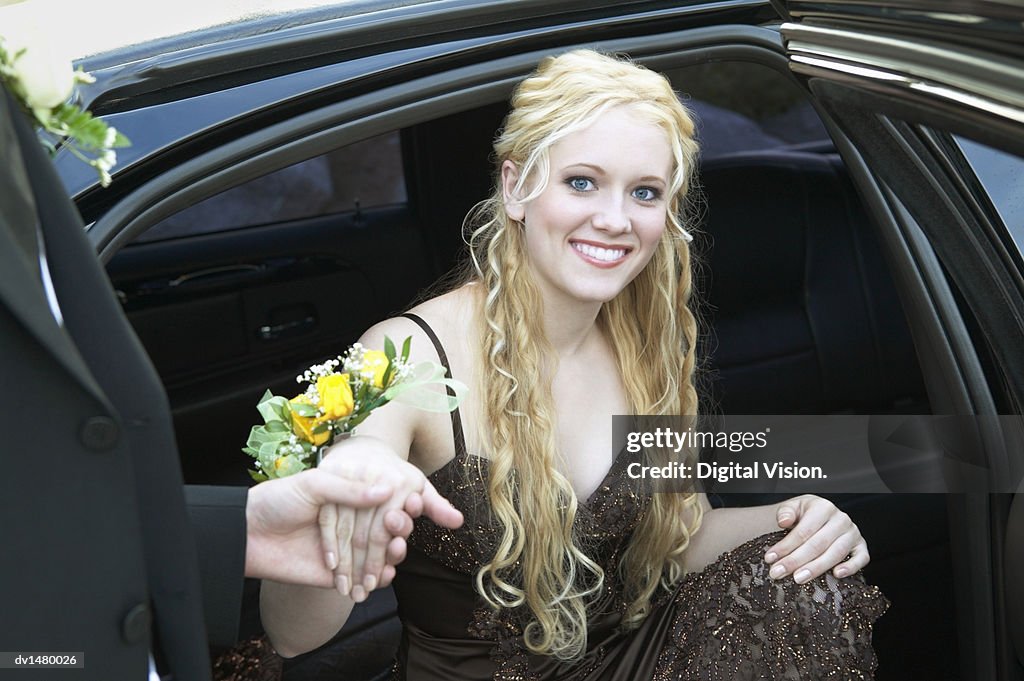 Young Woman Arriving in a Car to Her High School Prom