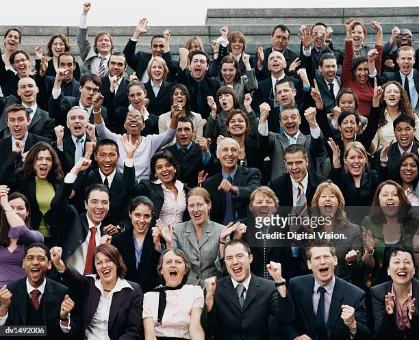 large group of business people sitting outdoors and cheering - business people cheering stockfoto's en -beelden