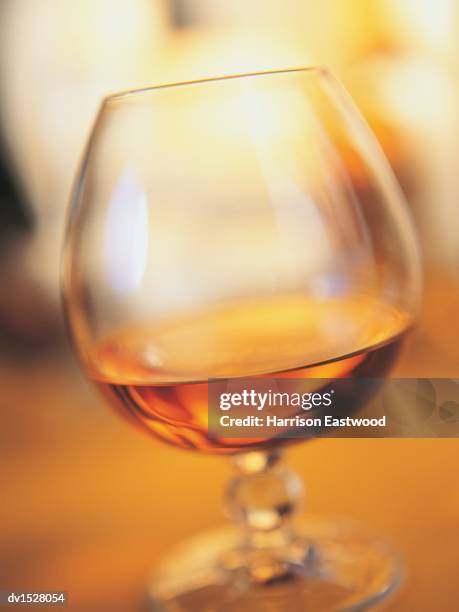 snifter of brandy - brandy snifter stock pictures, royalty-free photos & images