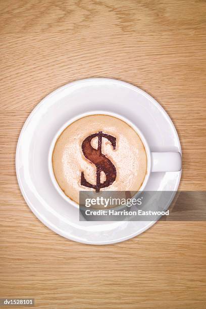 cup of cappachino with a dollar symbol made from choclate on top - coffee art stockfoto's en -beelden