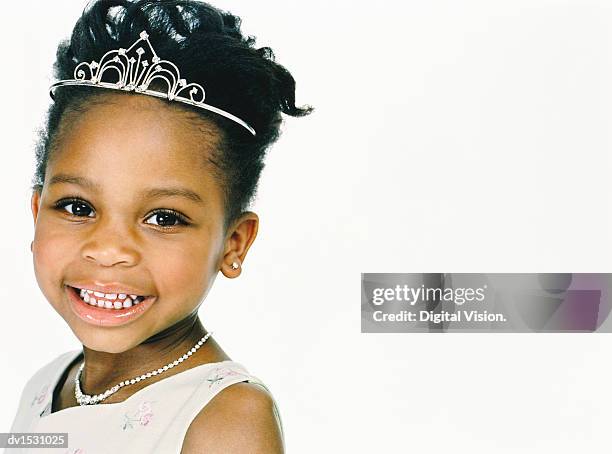 studio portrait of a young girl wearing a tiara and dressed as a princess - kids tiara stock pictures, royalty-free photos & images