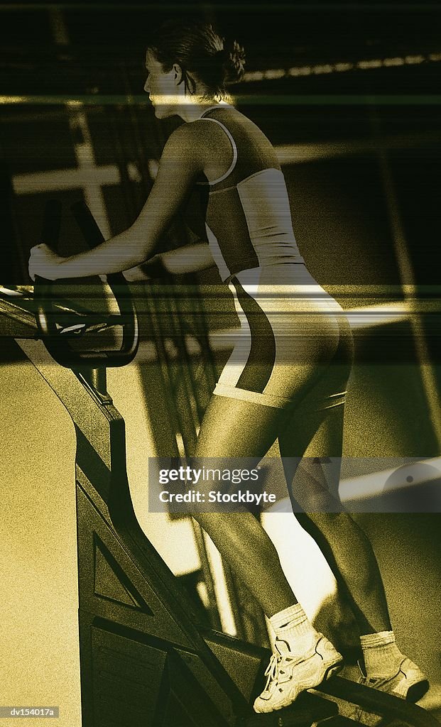 Woman using stair-climbing machine