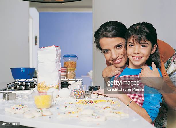 mother and daughter cooking in a kitchen - candy jar stock pictures, royalty-free photos & images
