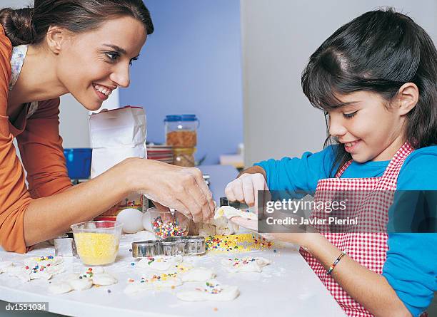 mother and daughter cooking in the kitchen - candy jar stock pictures, royalty-free photos & images