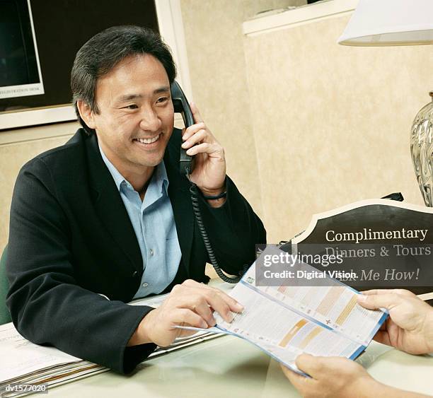 598 Handing Phone Over Stock Photos, High-Res Pictures, and Images ...