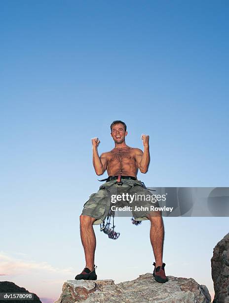 rock climber celebrates on a mountain peak - john peaks stock pictures, royalty-free photos & images